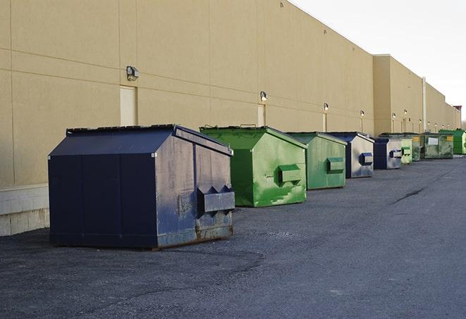 an aerial view of construction dumpsters placed on a large lot in Buford